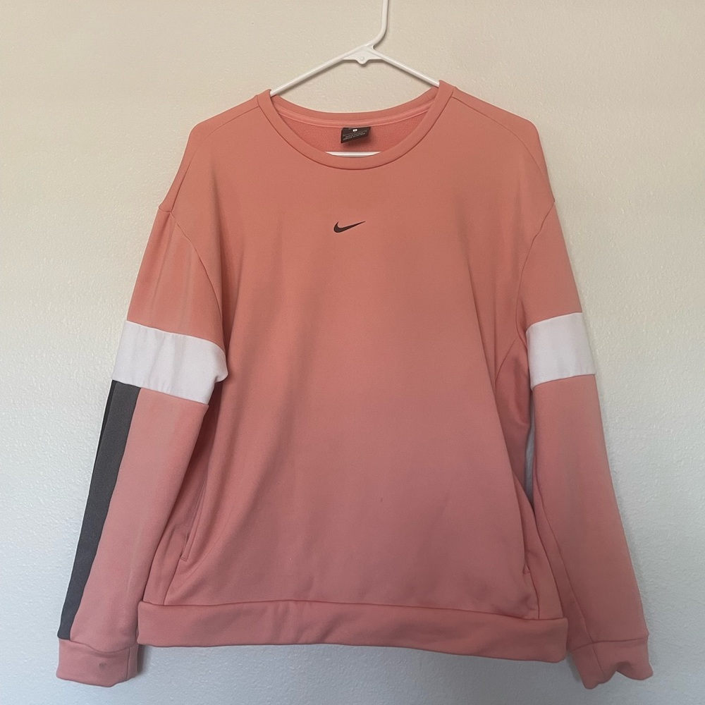 Gently used pink Nike pull over